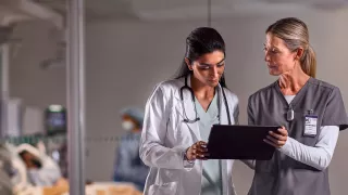 Two healthcare professionals discussing 