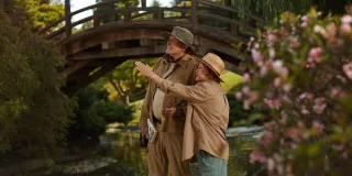 man and woman pointing into distance