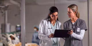 Two healthcare professionals discussing 